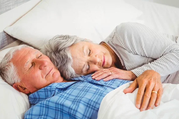 Elderly couple sleeping