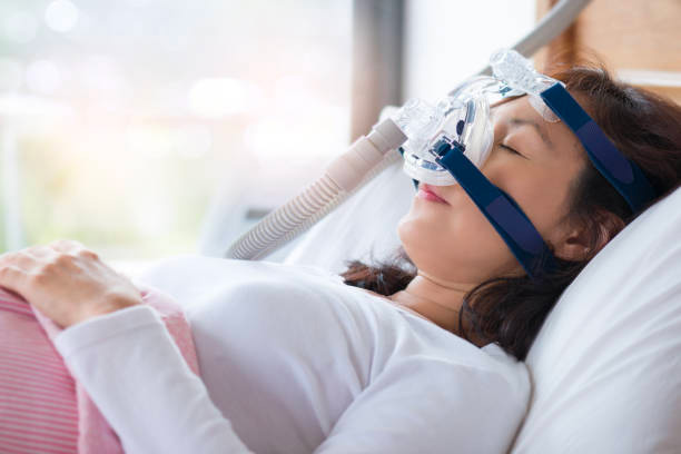 Sleep apnea woman with CPAP machine